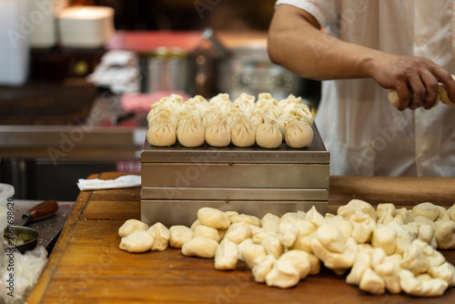 Steamed Bun Preparation At Restaurant Counter Low Angle