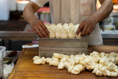 Steamed Bun Preparation At Restaurant Counter Wide View