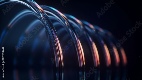 Abstract three dimensional metallic waves forming glowing light tunnel in dark space with dynamic colorful iridescent reflections and shadows.