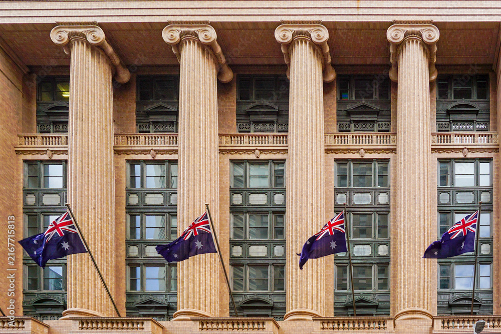 Naklejka premium Sydney building facade with Australian flags and Ionic columns