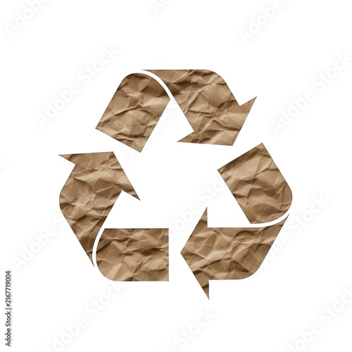 Recycle symbol made of brown crumpled paper texture