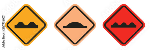 Speed Bump Road Signs: A set of three diamond-shaped road signs depicting various speed bumps in yellow, orange, and red, signaling caution to drivers on the road.