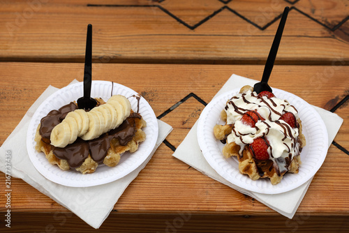 Obraz na plátně Pair of Belgian Liege Waffles with Banana and Strawberries