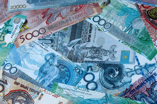 Fotografie Kazakhstani tenge money bills in pile on table