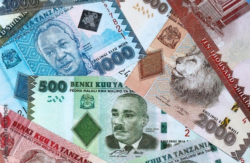Tanzanian shilling money bills in pile on table. Tanzania TZS currency cash close up
