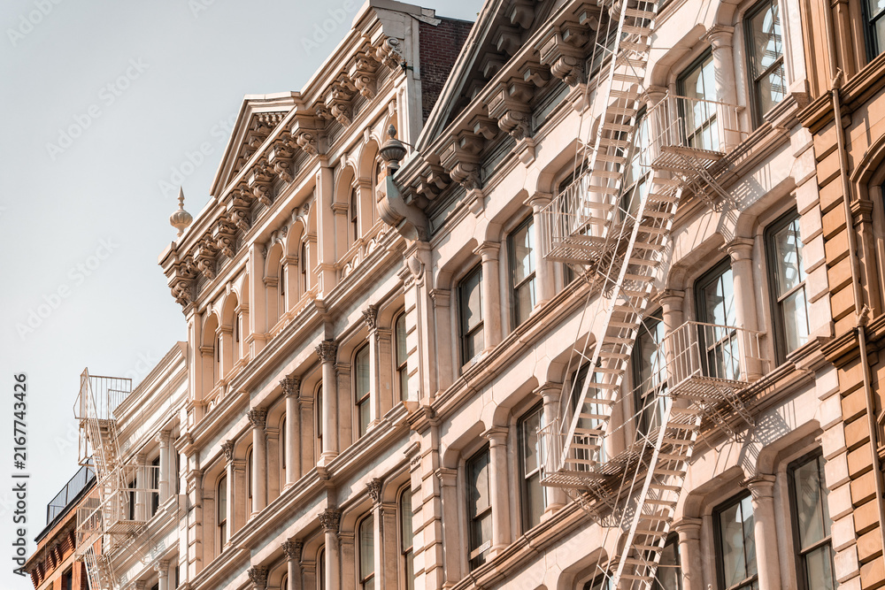 Fototapeta premium Street perspective of architecture in Tribeca Manhattan, New York City. SoHo, Chinatown, Financial District, Little Italy, Nolita
