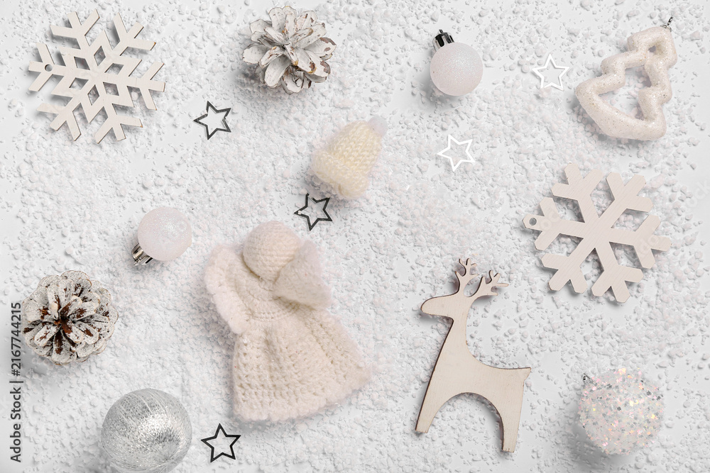 Fototapeta premium Composition with decorative snow, Christmas balls and decor on white background, closeup
