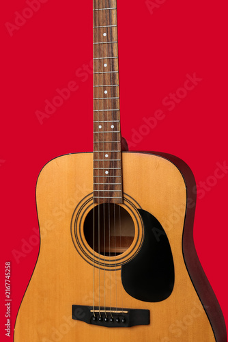 Obraz na płótnie Modern guitar on red background, closeup