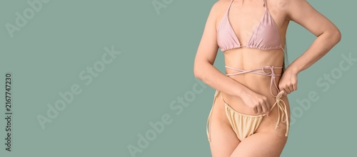 Konstfotografi Body positivity and self-acceptance, woman adjusting bikini bottom with natural