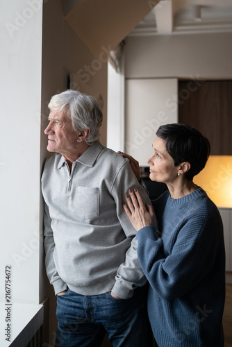 Cuadro en lienzo Concerned elderly man with distant gaze avoiding conversation with wife trying to connect