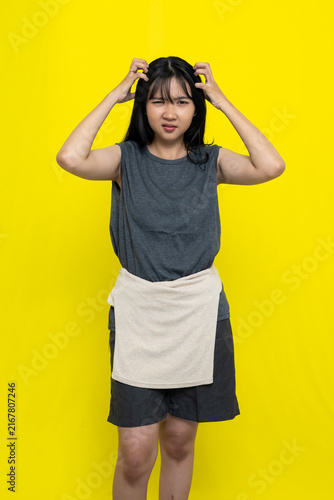 Bild auf Leinwand Confused Young Asian Woman Scratching Her Head Wearing Dark Grey Top Against Bri