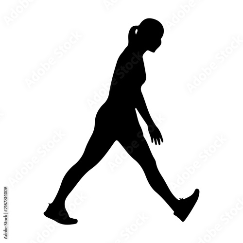 Silhouette of a Walking Woman in Profile.