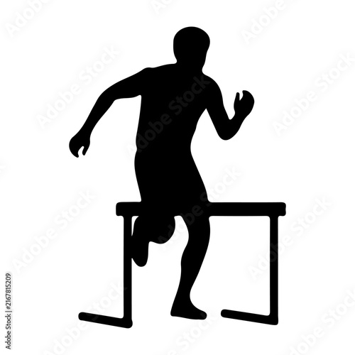 Athlete Jumping Over Hurdle in Track Race.