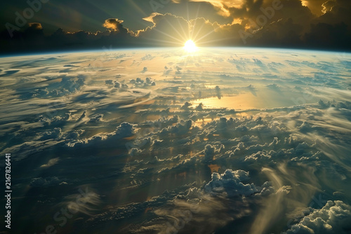 Sunrise Over Earth, A breathtaking view of Earth from space, with the sun rising above the horizon, casting warm, golden glow across the clouds and ocean.