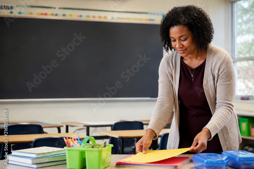 Elementary Teacher Preparing Bright Classroom