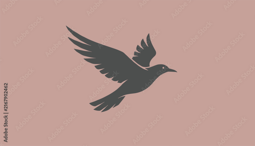 Obraz premium Dark grey silhouette of a flying bird in mid-air with outstretched wings on a dusty rose pink background.