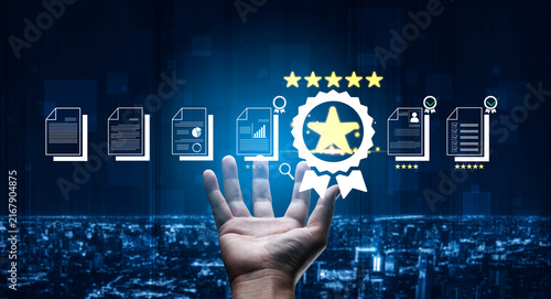 Photography Hand Reaching for Digital Badge with Five Stars Among Files and Charts, Symbolizing Achievement and Recognition of Quality in Business Performance Fluxor