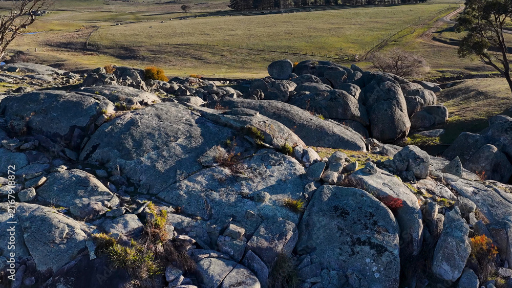 Fototapeta premium Aerial View of Granite Boulders and Rural Landscape in Uralla