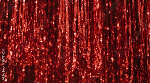 Vibrant Red Glittering Streamers for Celebrations and Events.