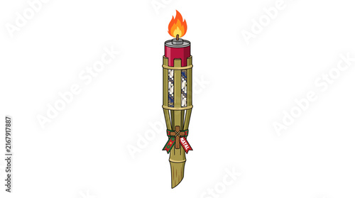 Traditional bamboo torch with batik pattern and Christmas ribbon lit for holiday celebration