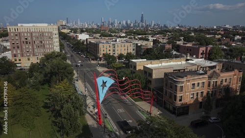 Puerto Rican flag in Humboldt Park, Chicago. Taken June 23rd, 2026 in Chicago, IL - The drone rotates around the flag with the skyline in the background