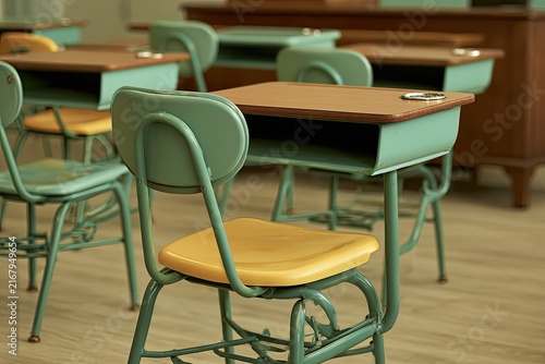 Vintage classroom with teal desks and yellow seats, empty