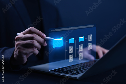 Принти на полотні Digital file management concept showing organized folders and documents on a laptop, representing data storage, document organization, workflow, information management, and secure digital access