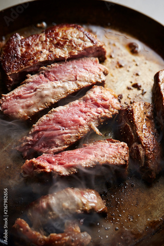 Beef steak in an iron pan