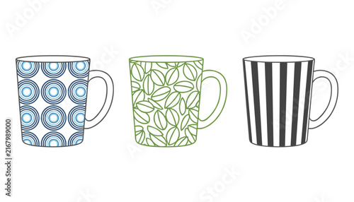 Three ceramic coffee mugs display creative patterns of blue concentric circles green leaf designs and black vertical stripes.