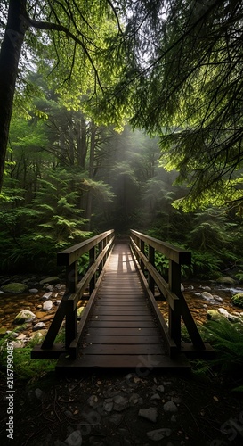 Sun rays piercing through mist onto a rustic wooden bridge over a flowing stream in a vibrant green forest, creating an ethereal and peaceful nature scene.