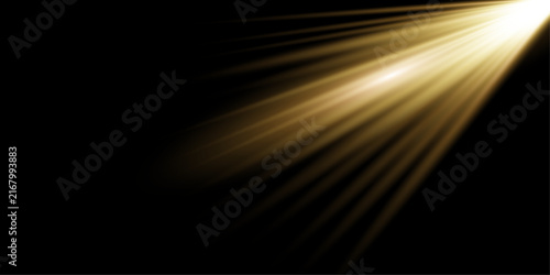 A bright golden light effect shining diagonally across a deep black background for creative design projects