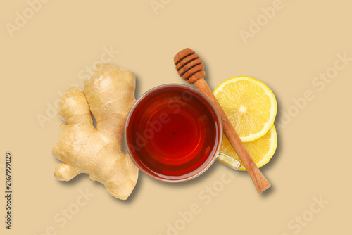 Quadro su tela Ginger root is displayed with honey and lemon slices beside a cup of tea
