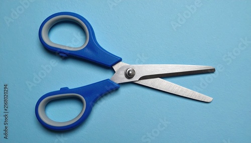 Blue-handled household scissors with stainless steel blades, stationery and craft tool photography
