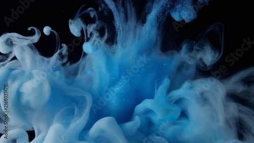 4K close-up footage of acrylic paint dispersion in liquid. Blue glittery steam rise