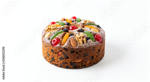 Homemade fruit cake with colorful toppings on white background