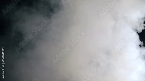 White smoke or fog rolling and billowing isolated on a black background