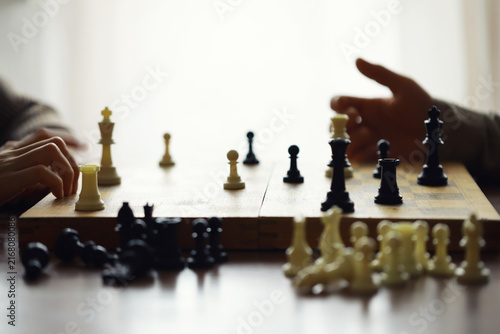 Obraz na plátně Hand playing game of chess, competition, strategy, battle, play