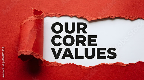 Revealed core values displayed on torn paper background