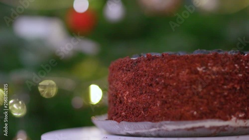 Festive Red Velvet Cake with Blueberries and Holiday Bokeh Lights