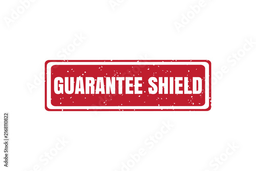 A rectangular red rubber stamp with the words guarantee shield written in bold white capital letters on a white background, for validation isolated on a transparent background