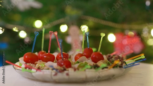 Close-up of Festive Appetizers with Cherry Tomatoes and Bokeh Lights