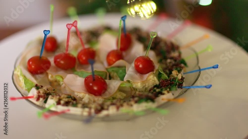Festive Plate of Gourmet Appetizers with Cherry Tomatoes and Meat Skewers