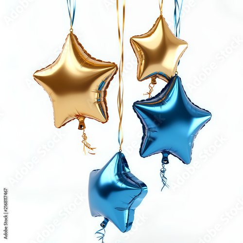 Gold and blue star shaped foil balloons hanging on strings against a white background with copy space.