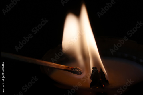 flames of a candle and a match
