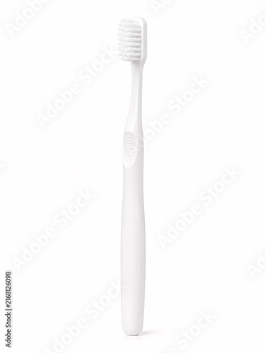 Simple white toothbrush on plain surface