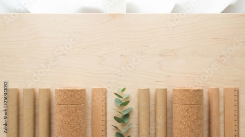 Eco Friendly Wooden Stationery Border on Light Wood Background With Copy Space