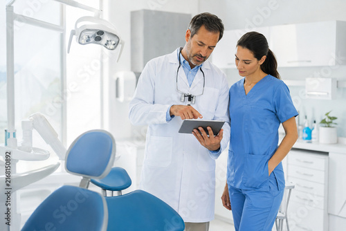 Dental Team Reviewing Patient Case Between Appointments