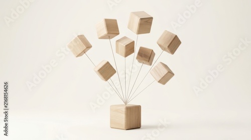 A wooden sculpture featuring multiple small wooden cubes connected by thin wires to a larger base, isolated on a white background