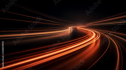 Abstract orange light trails on dark winding road representing high speed and connectivity
