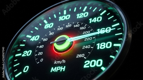 Speedometer at Maximum Speed: A glowing speedometer needle points to 160 km/h and MPH, indicating rapid acceleration and high performance, set against a dark, high-tech background.